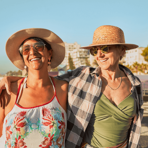 Two women hugging in the sun