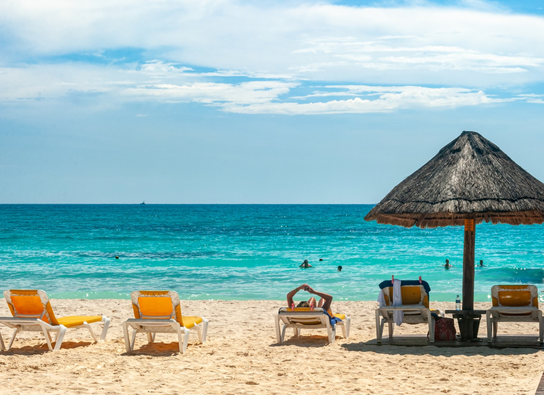 A view of the beach with umbrellas