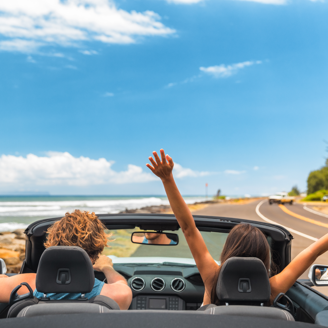 Two friends riding in a convertible